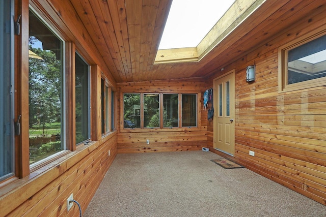 2518 Borg Rd, Delavan, WI 53115 - unfurnished sunroom featuring a skylight, wood walls, plenty of natural light, wooden ceiling, and lofted ceiling