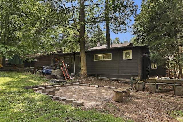 2518 Borg Rd, Delavan, WI 53115 - rear view of house featuring a lawn