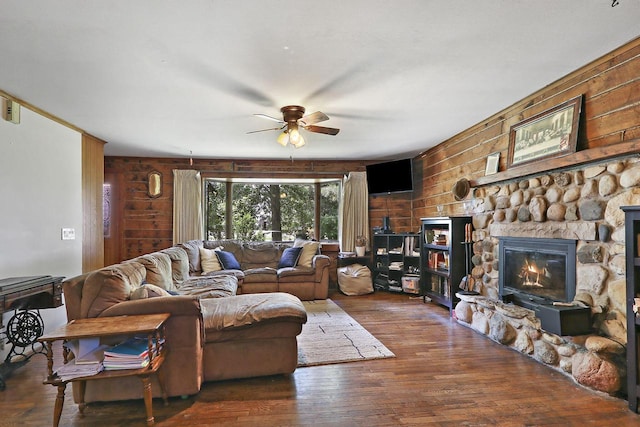 2518 Borg Rd, Delavan, WI 53115 - living area featuring ceiling fan, wooden walls, hardwood / wood-style floors, and a stone fireplace
