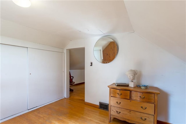 N8355 330th St, Spring Valley, WI 54767 - bedroom featuring lofted ceiling, light wood-style flooring, and a closet