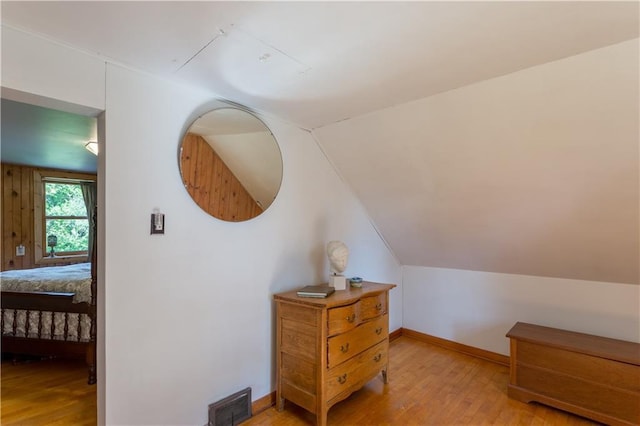 N8355 330th St, Spring Valley, WI 54767 - bedroom featuring light wood-style flooring, baseboards, and lofted ceiling