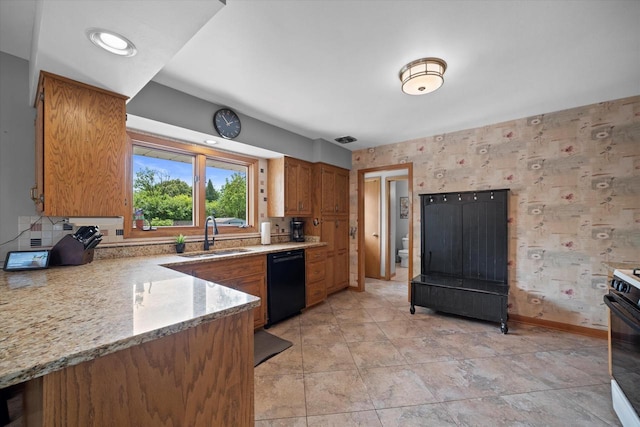 7101 W Tripoli Ave, Milwaukee, WI 53220 - kitchen with black dishwasher, gas stove, brown cabinetry, and light stone countertops