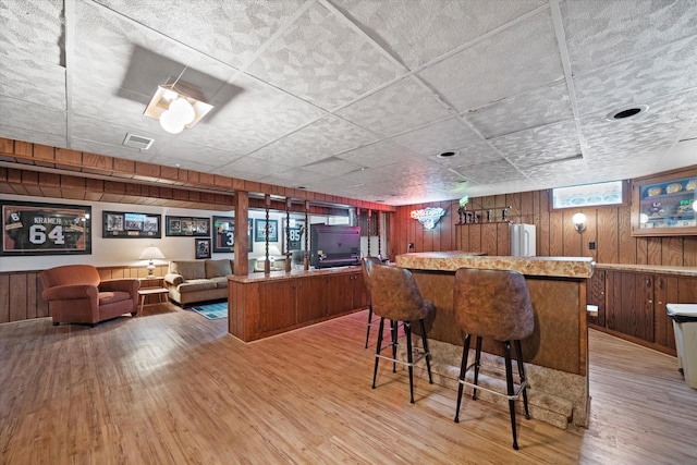 7101 W Tripoli Ave, Milwaukee, WI 53220 - indoor dry bar with wooden walls and light wood finished floors
