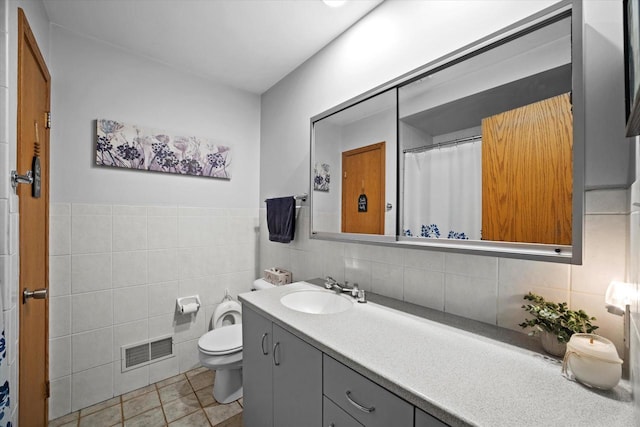 7101 W Tripoli Ave, Milwaukee, WI 53220 - bathroom featuring vanity, tile walls, and tile patterned floors