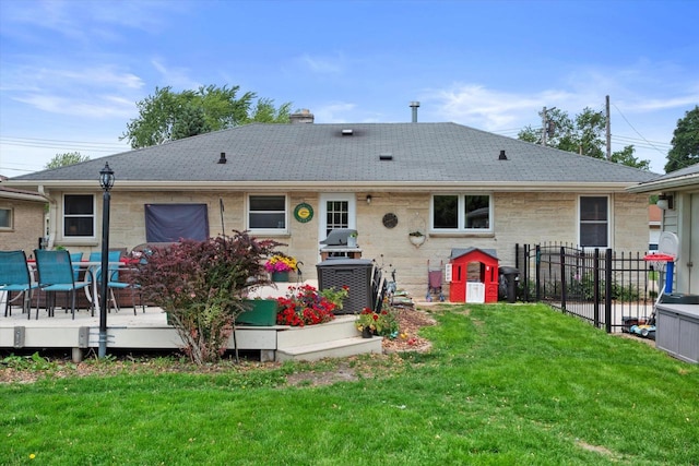 7101 W Tripoli Ave, Milwaukee, WI 53220 - rear view of house featuring a deck, a shingled roof, a chimney, and stone siding