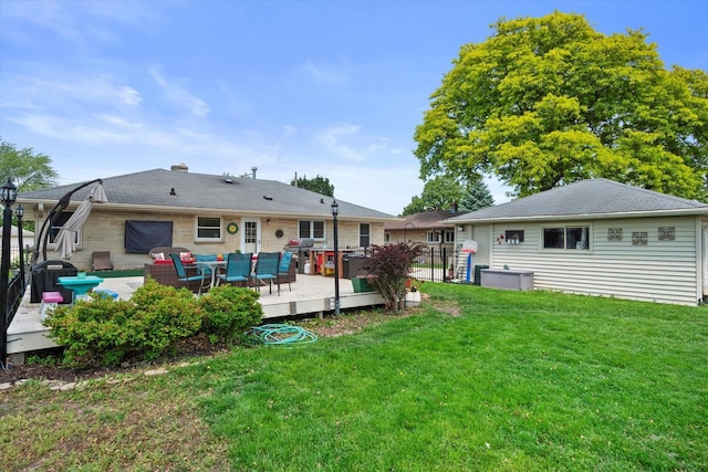 7101 W Tripoli Ave, Milwaukee, WI 53220 - rear view of property featuring a wooden deck, a yard, and outdoor lounge area