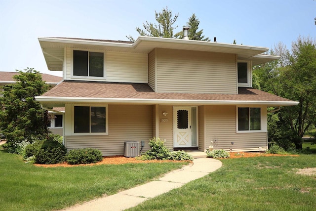 525 Walnut Grove Dr, Madison, WI 53717 - view of front of home with a front yard, a shingled roof, and cooling unit