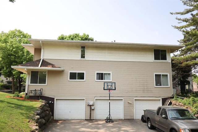 525 Walnut Grove Dr, Madison, WI 53717 - rear view of property featuring an attached garage and driveway