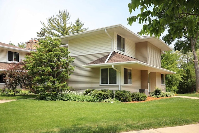 525 Walnut Grove Dr, Madison, WI 53717 - view of front facade featuring a front lawn and central AC unit