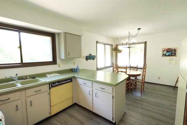 525 Walnut Grove Dr, Madison, WI 53717 - kitchen featuring dishwashing machine, a sink, a peninsula, light countertops, and a chandelier