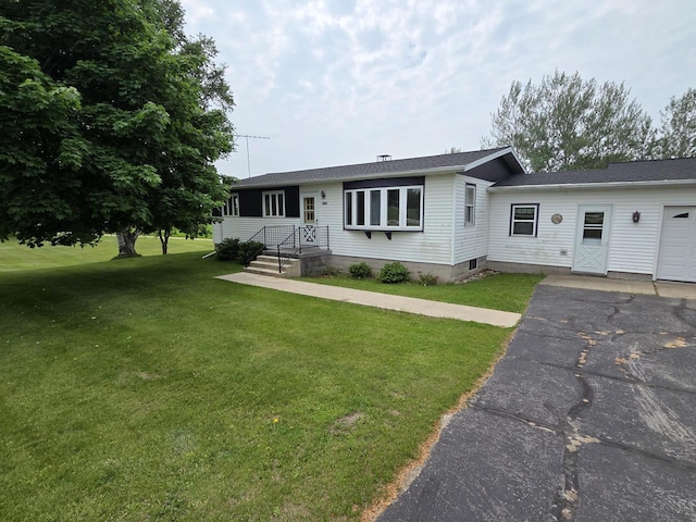 3803 State Highway 147 W, Two Rivers, WI 54241 - ranch-style home featuring a front lawn, a garage, and asphalt driveway