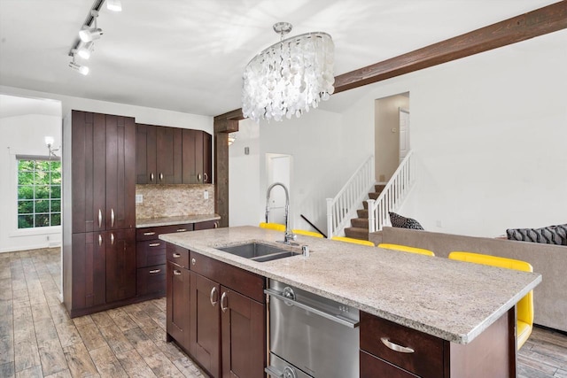 6650 N 114th St, Milwaukee, WI 53224 - kitchen with a sink, dishwasher, light wood-type flooring, a chandelier, and tasteful backsplash
