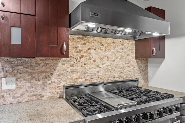 6650 N 114th St, Milwaukee, WI 53224 - kitchen featuring wall chimney exhaust hood, high end stainless steel range, tasteful backsplash, and light countertops