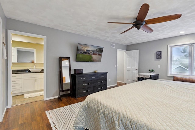 4441 N John Paul Rd, Milton, WI 53546 - bedroom with dark wood-style flooring, a sink, baseboards, connected bathroom, and ceiling fan