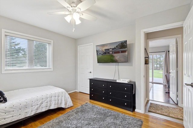 4441 N John Paul Rd, Milton, WI 53546 - bedroom featuring wood finished floors, baseboards, and a ceiling fan