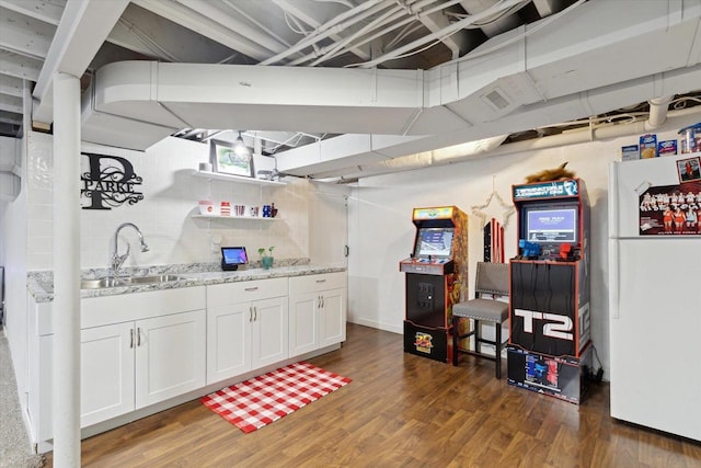 4441 N John Paul Rd, Milton, WI 53546 - bar featuring a sink, wood finished floors, and freestanding refrigerator