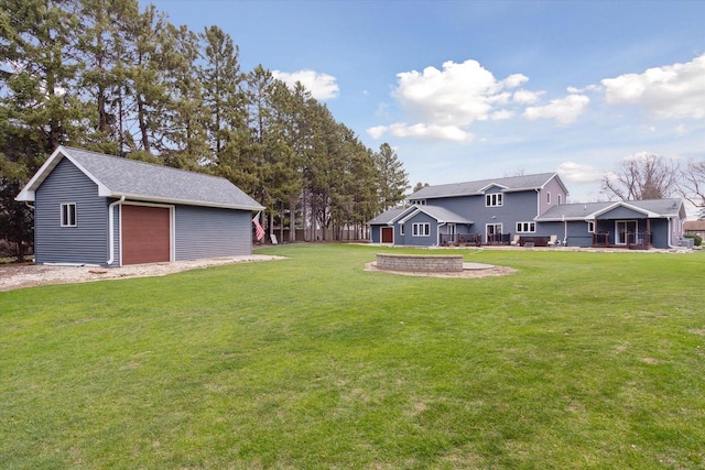4441 N John Paul Rd, Milton, WI 53546 - view of grassy yard with an outdoor structure and a garage