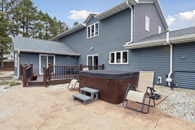4441 N John Paul Rd, Milton, WI 53546 - rear view of property featuring a hot tub, a patio area, a deck, and a shingled roof