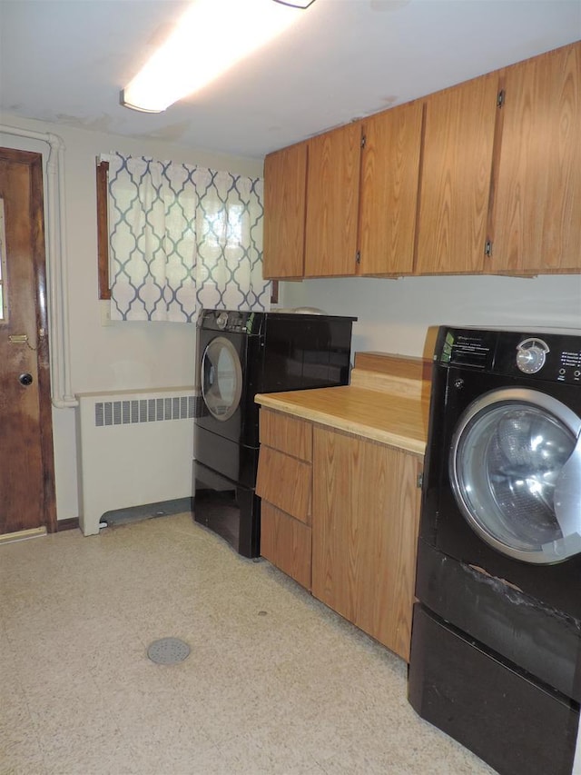 422 E Catherine St, Muscoda, WI 53573 - washroom with radiator heating unit, washer / dryer, and light flooring