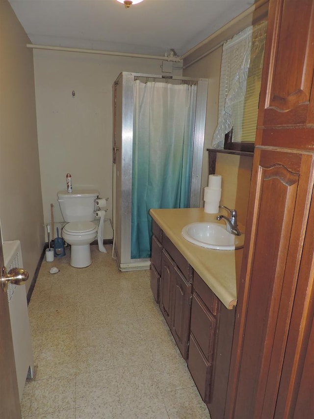 422 E Catherine St, Muscoda, WI 53573 - bathroom with toilet, a shower with curtain, vanity, tile patterned floors, and baseboards