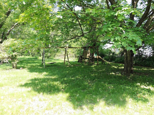 422 E Catherine St, Muscoda, WI 53573 - view of green lawn with a playground