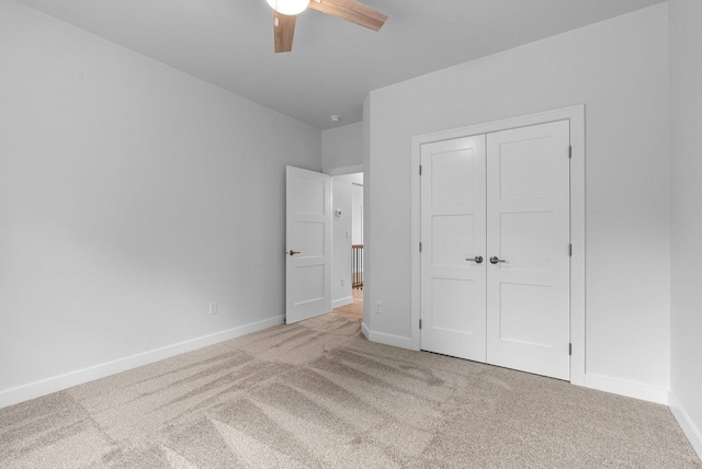 3566 W Hank Ave, De Pere, WI 54115 - unfurnished bedroom with carpet, baseboards, a closet, and a ceiling fan