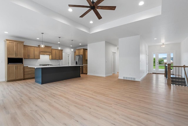 3566 W Hank Ave, De Pere, WI 54115 - kitchen featuring open floor plan, light wood-style flooring, stainless steel fridge with ice dispenser, recessed lighting, and brown cabinetry