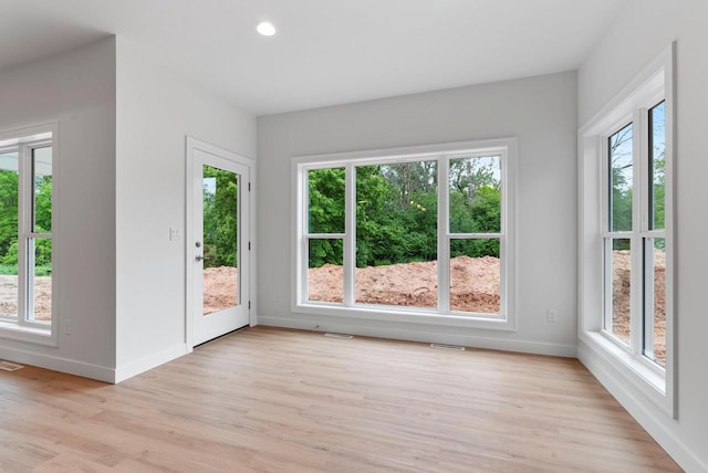 3566 W Hank Ave, De Pere, WI 54115 - empty room featuring baseboards, light wood-style floors, and recessed lighting