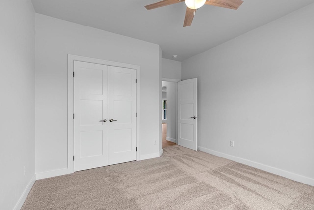 3566 W Hank Ave, De Pere, WI 54115 - unfurnished bedroom featuring carpet flooring, baseboards, a closet, and ceiling fan