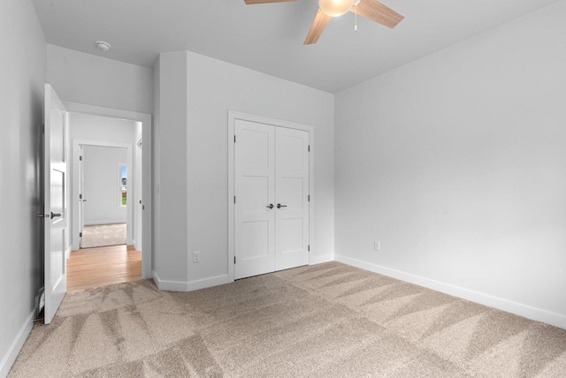 3566 W Hank Ave, De Pere, WI 54115 - unfurnished bedroom featuring carpet, baseboards, a closet, and a ceiling fan