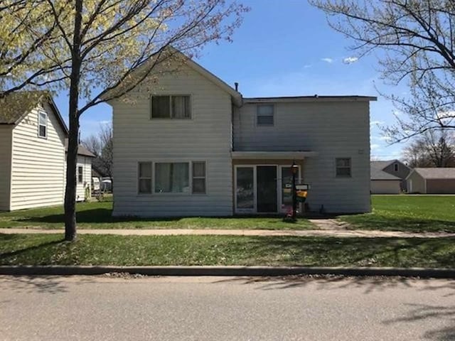 205 N Thomas St, Merrill, WI 54452 - rear view of house featuring a yard