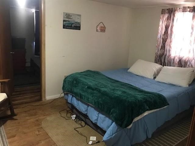 205 N Thomas St, Merrill, WI 54452 - bedroom with wood finished floors and baseboards