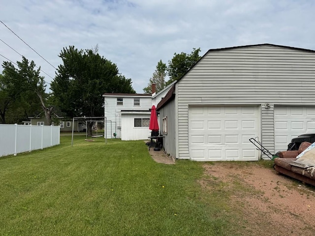 205 N Thomas St, Merrill, WI 54452 - view of yard featuring a garage, an outdoor structure, and driveway