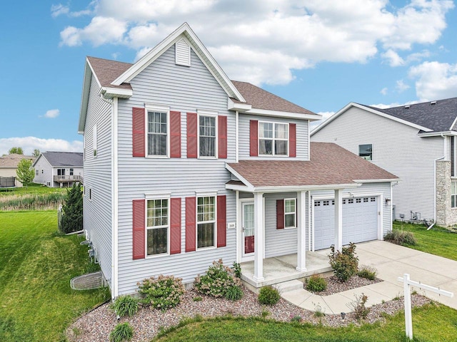 2418 Leopold Way, Sun Prairie, WI 53590 - traditional-style home featuring an attached garage, driveway, a front yard, and a shingled roof