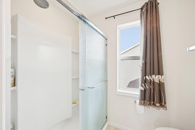 2418 Leopold Way, Sun Prairie, WI 53590 - bathroom featuring a stall shower and baseboards