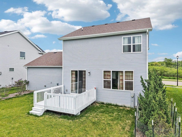 2418 Leopold Way, Sun Prairie, WI 53590 - rear view of house with a lawn, a wooden deck, and roof with shingles