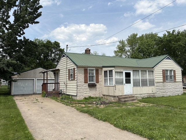 230 Park Ave, Wisconsin Rapids, WI 54495 - view of front of house with a chimney, an outdoor structure, stone siding, and entry steps