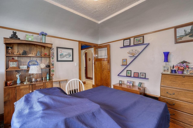 1107 S 71st St Unit 1109, West Allis, WI 53214 - bedroom featuring arched walkways and a textured ceiling