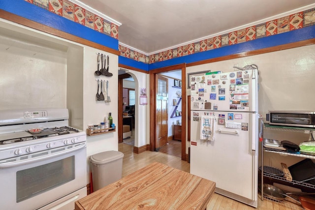 1107 S 71st St Unit 1109, West Allis, WI 53214 - kitchen featuring white appliances, arched walkways, and light wood finished floors