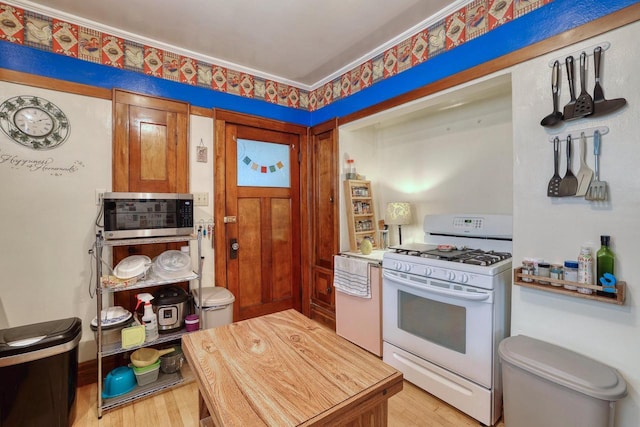 1107 S 71st St Unit 1109, West Allis, WI 53214 - kitchen featuring white gas range and light wood finished floors