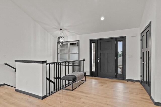 1338 Highland Ridge Dr, De Pere, WI 54115 - foyer featuring a chandelier, wood finished floors, baseboards, plenty of natural light, and recessed lighting