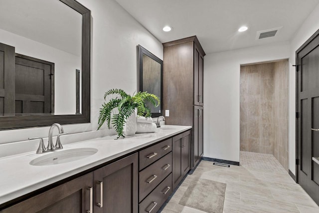 1338 Highland Ridge Dr, De Pere, WI 54115 - bathroom with double vanity, recessed lighting, and a walk in shower