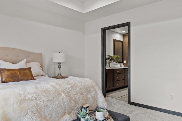 1338 Highland Ridge Dr, De Pere, WI 54115 - bedroom with light carpet, a sink, baseboards, and ensuite bath