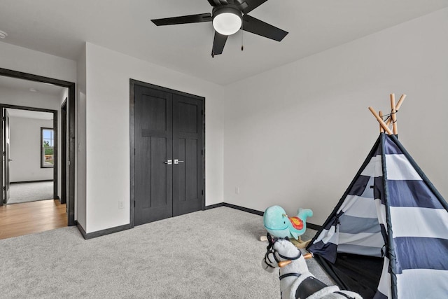 1338 Highland Ridge Dr, De Pere, WI 54115 - recreation room featuring carpet flooring, a ceiling fan, and baseboards