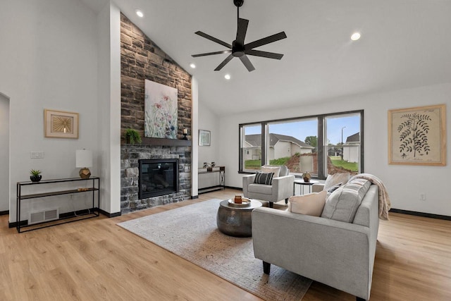 1338 Highland Ridge Dr, De Pere, WI 54115 - living room with high vaulted ceiling, ceiling fan, wood finished floors, a fireplace, and baseboards