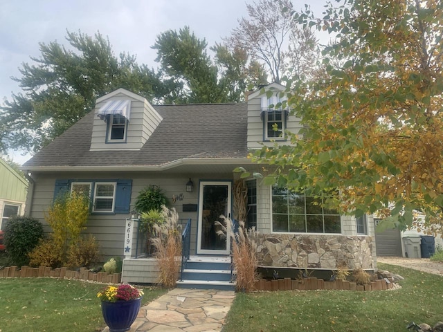 6619 W Fremont Pl, Milwaukee, WI 53219 - cape cod-style house with a front lawn and roof with shingles