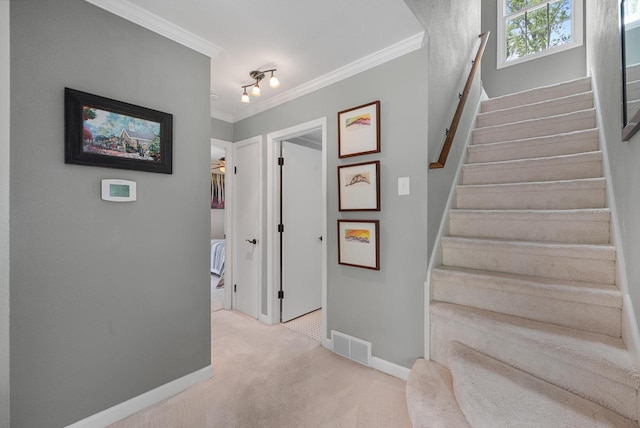 6619 W Fremont Pl, Milwaukee, WI 53219 - hallway featuring light carpet, stairs, crown molding, and rail lighting