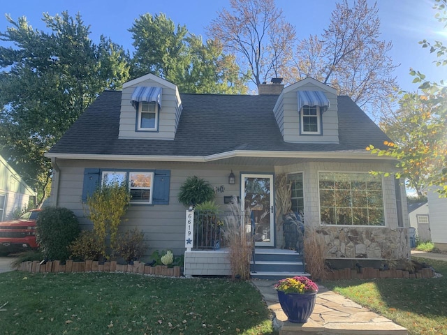 6619 W Fremont Pl, Milwaukee, WI 53219 - cape cod home with a chimney, a front yard, and roof with shingles