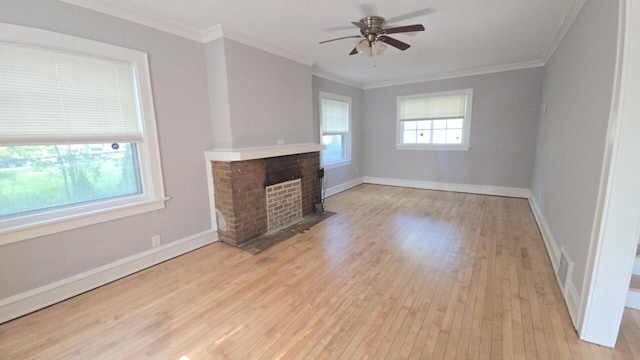 5415 N 36th St, Milwaukee, WI 53209 - unfurnished living room with hardwood / wood-style floors, a ceiling fan, a fireplace with flush hearth, crown molding, and baseboards