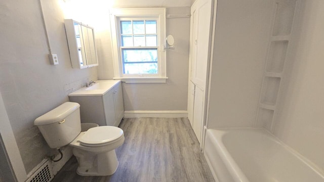 5415 N 36th St, Milwaukee, WI 53209 - full bath with wood finished floors, vanity, toilet, baseboards, and shower / washtub combination